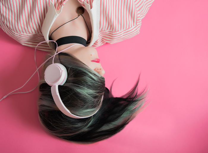 girl resting eyes listening to audiobooks